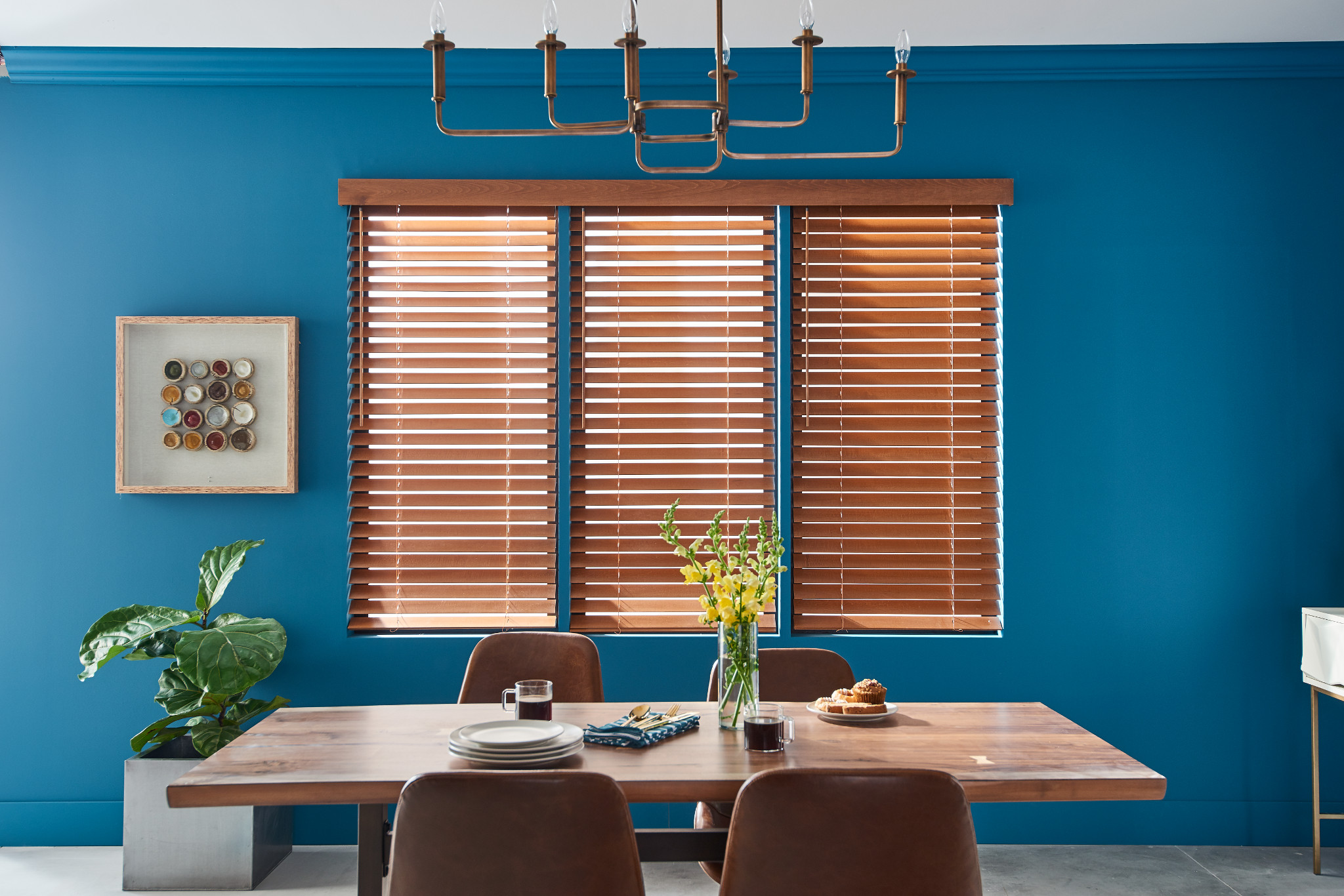 Premium blinds installed on multiple windows in a living room